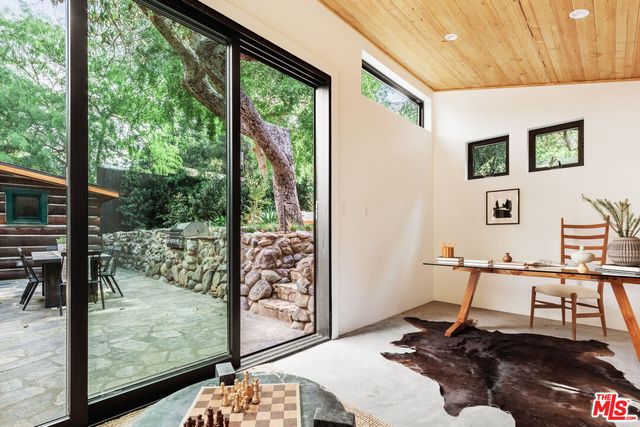 a living room with furniture and a rug