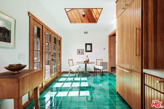 a kitchen with a stove a sink and a refrigerator