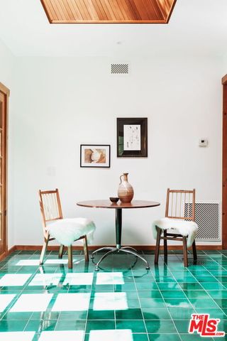a kitchen with stainless steel appliances wooden cabinets and a stove top oven