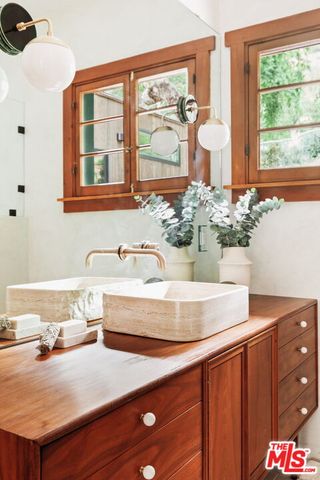 a bed room with a bed and a window