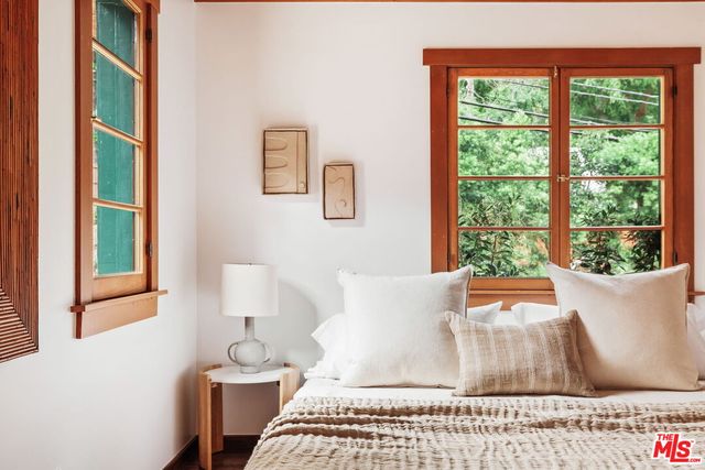 a view of backyard with plants and outdoor seating