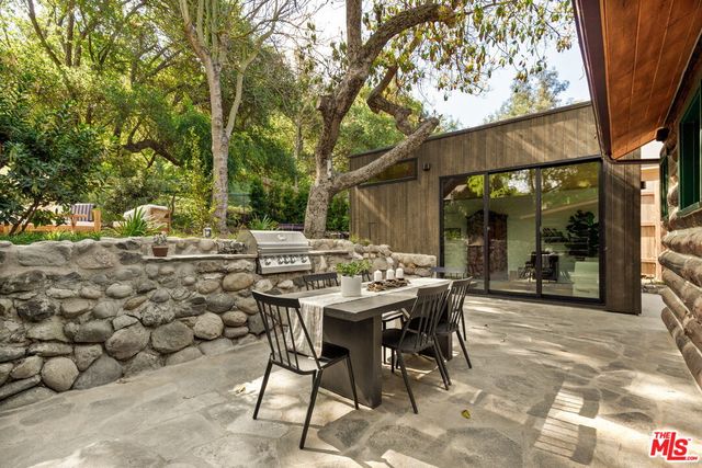 a front view of a house with wooden stairs