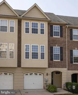 a front view of a house with many windows