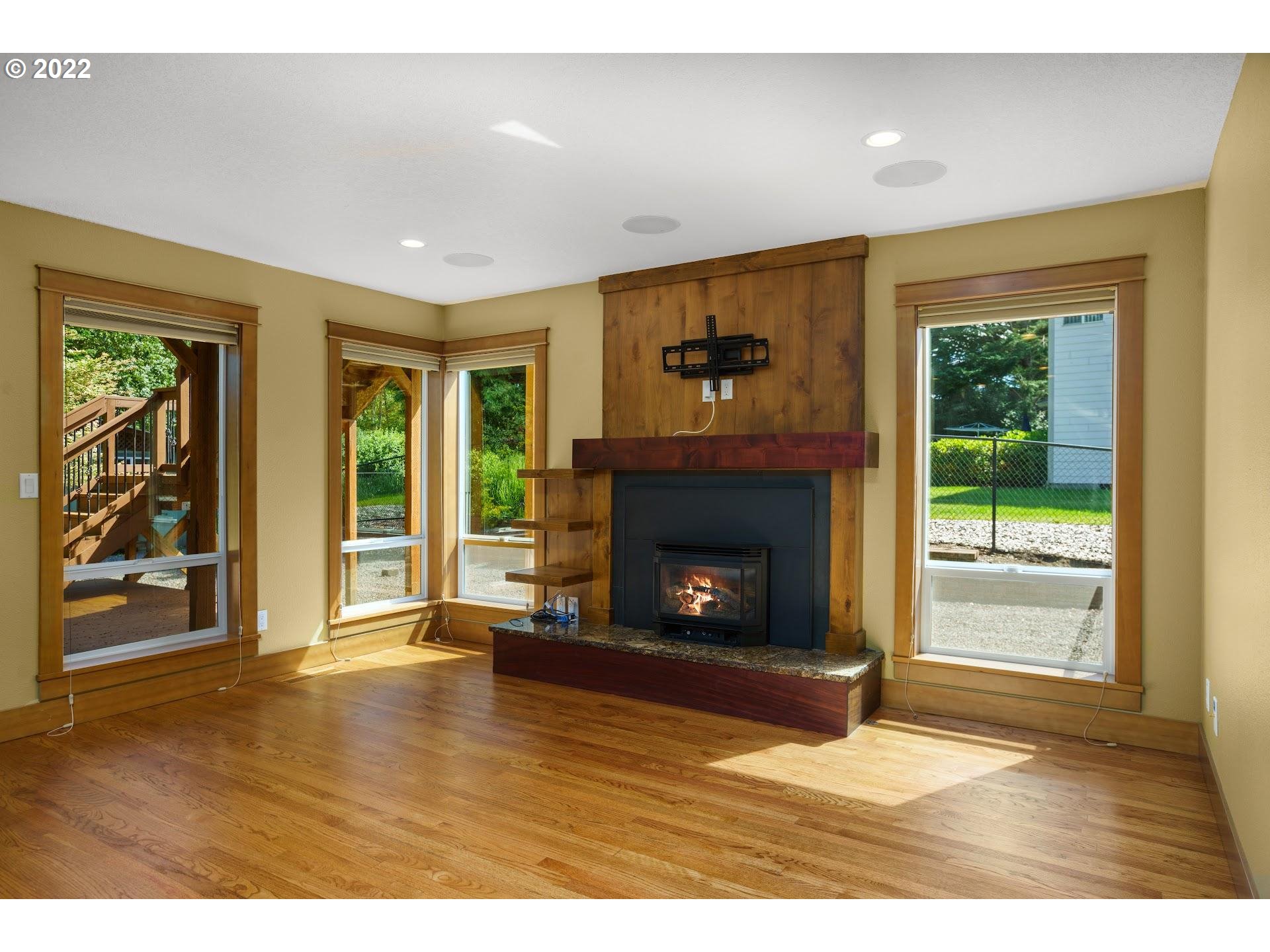 3616 Northeast Corbin Road Vancouver, WA 98686 - Photo 8 of 32 a view of an empty room with a fireplace and window