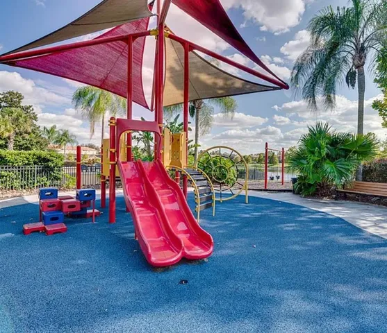 a view of a backyard with plants and a patio