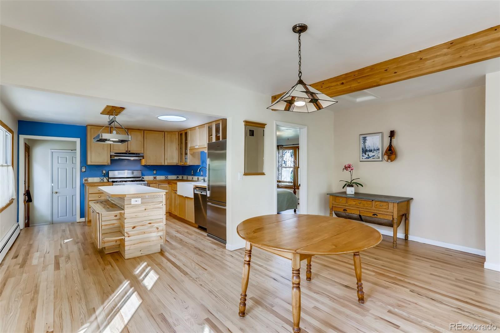 1521 Marshall Road Boulder, CO 80305 - Photo 11 of 40 a kitchen with white cabinets and stainless steel appliances