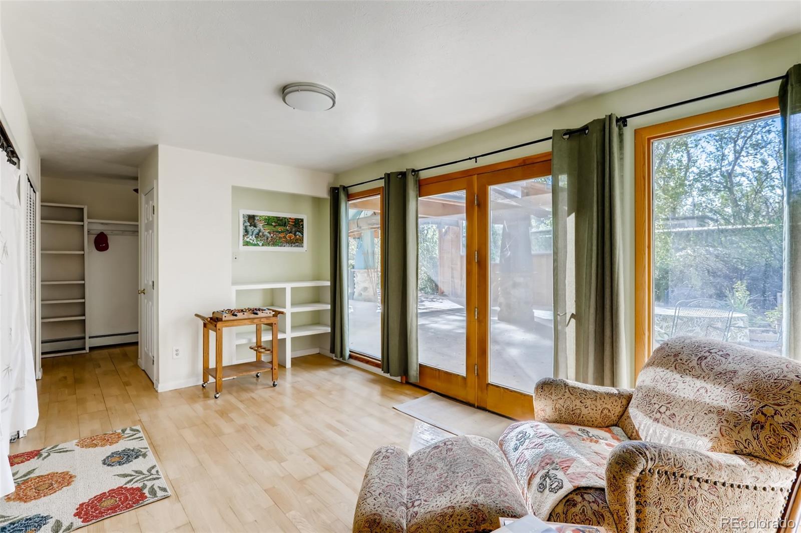 1521 Marshall Road Boulder, CO 80305 - Photo 13 of 40 a bedroom with furniture and large windows