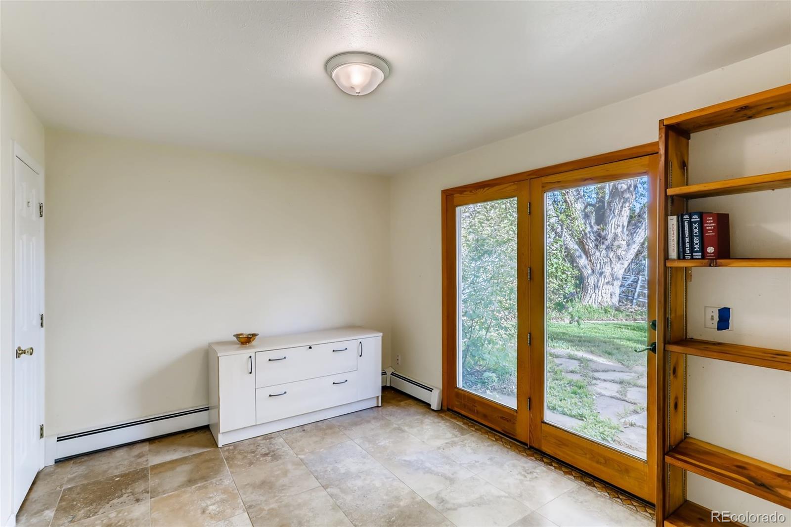 1521 Marshall Road Boulder, CO 80305 - Photo 14 of 40 a view of an empty room with a window