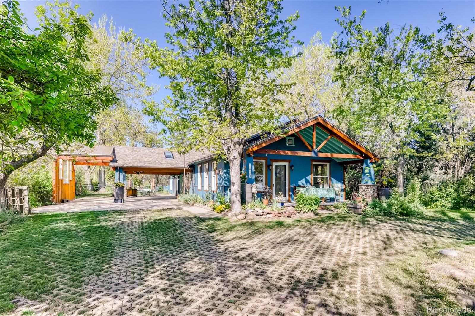 1521 Marshall Road Boulder, CO 80305 - Photo 2 of 40 a front view of a house with a yard