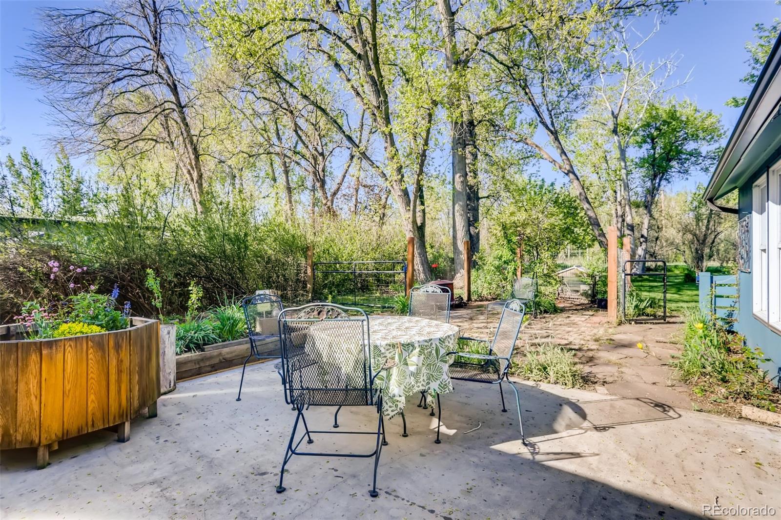 1521 Marshall Road Boulder, CO 80305 - Photo 23 of 40 a view of backyard with a table and chairs