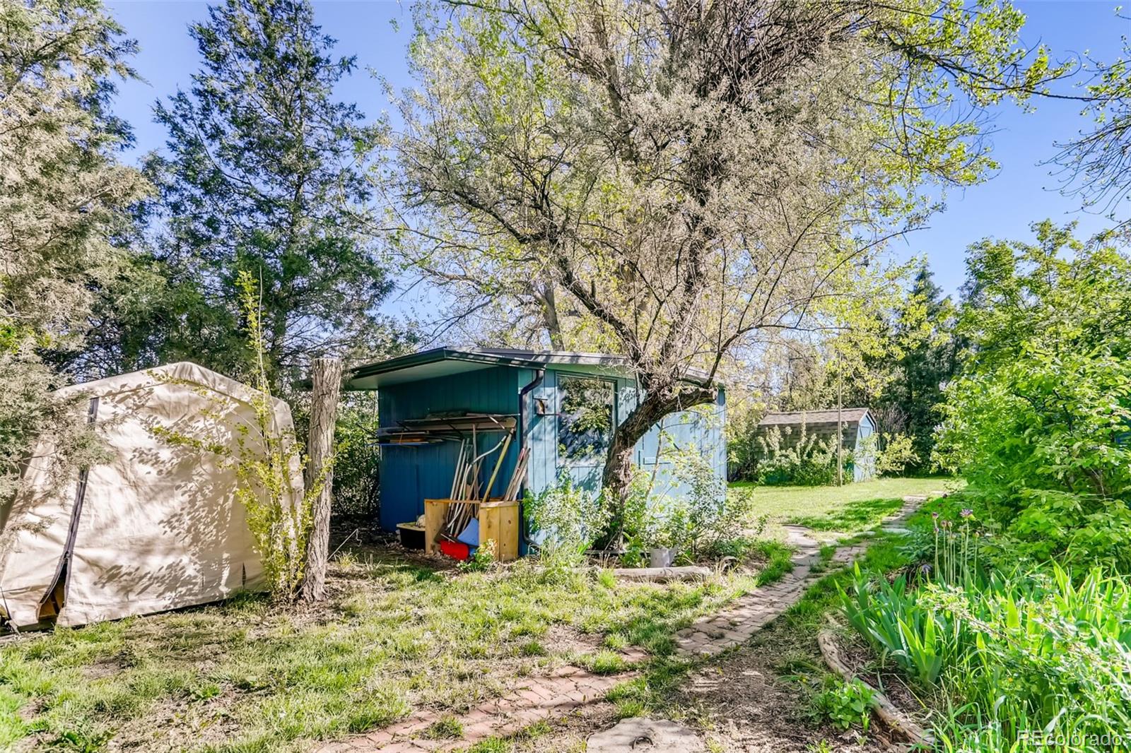 1521 Marshall Road Boulder, CO 80305 - Photo 24 of 40 a view of a house with a yard