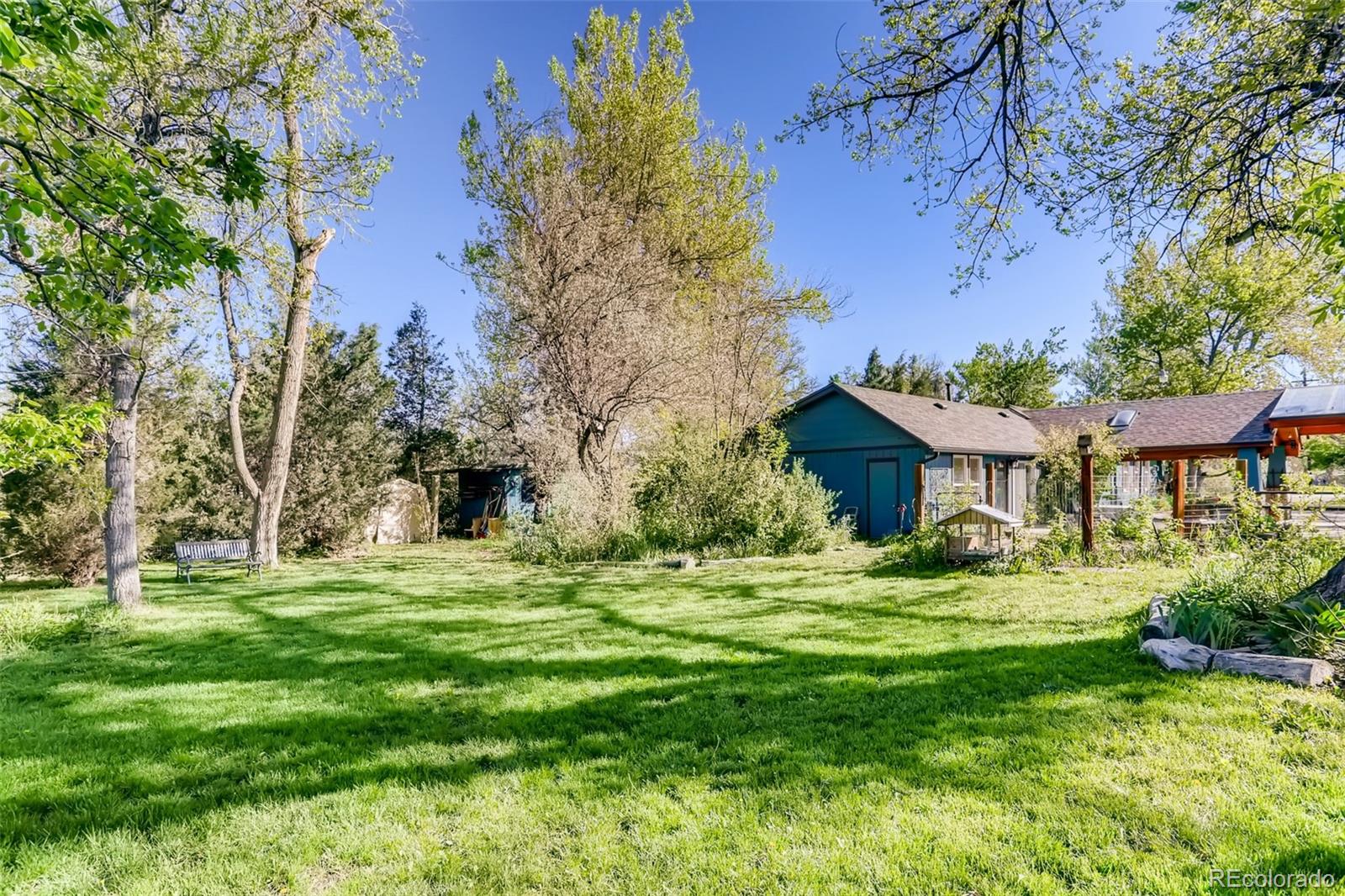 1521 Marshall Road Boulder, CO 80305 - Photo 25 of 40 a big house with a big yard and large trees