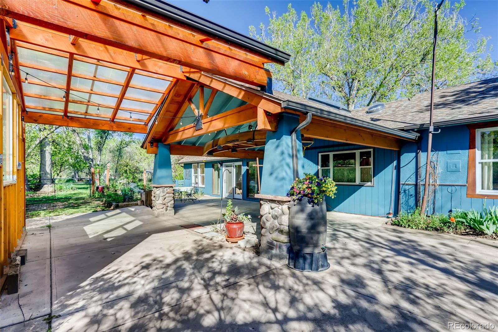 1521 Marshall Road Boulder, CO 80305 - Photo 32 of 40 a view of a patio with a table and chairs and potted plants