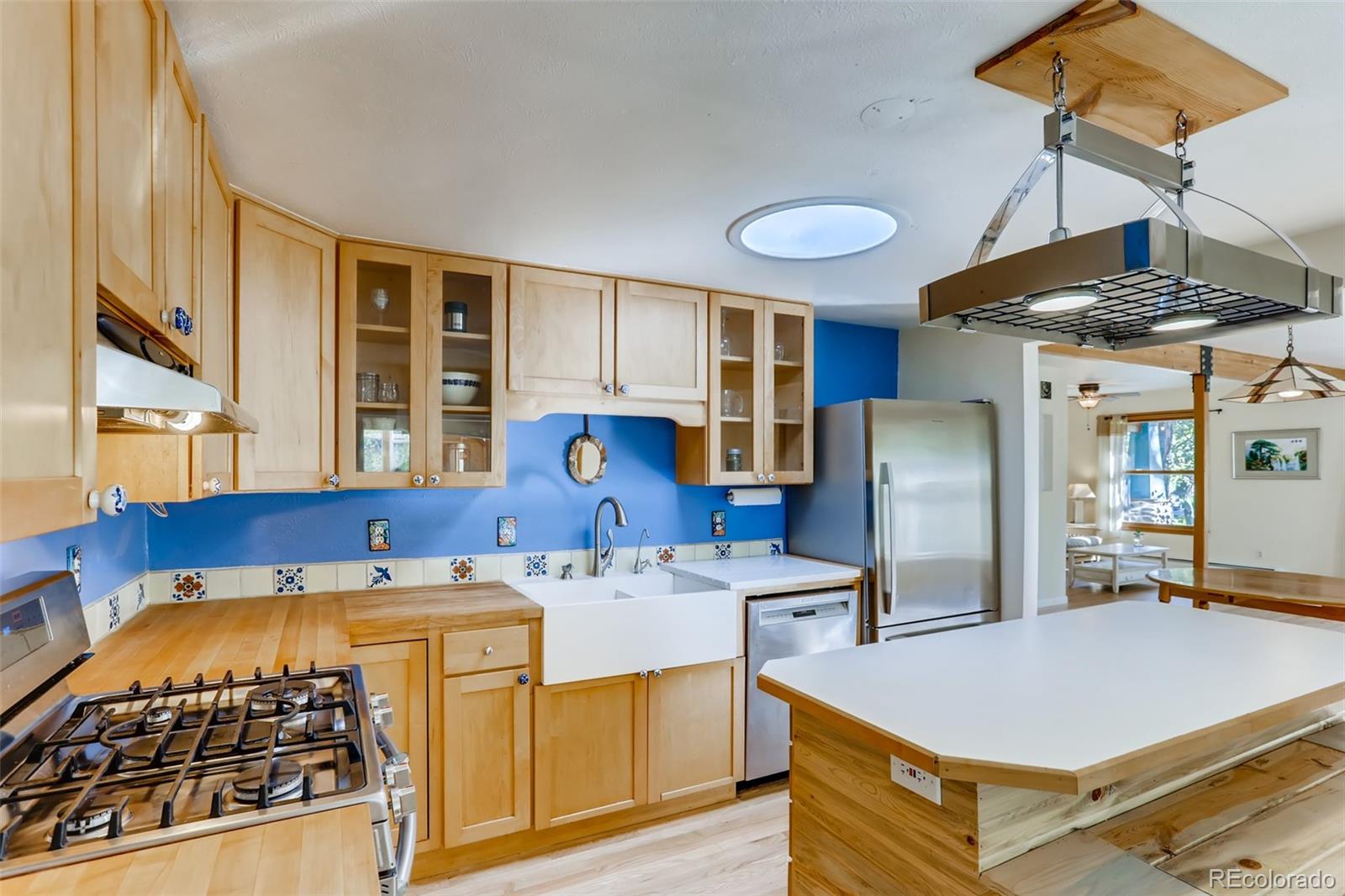 1521 Marshall Road Boulder, CO 80305 - Photo 8 of 40 a kitchen with stainless steel appliances granite countertop a stove and a refrigerator