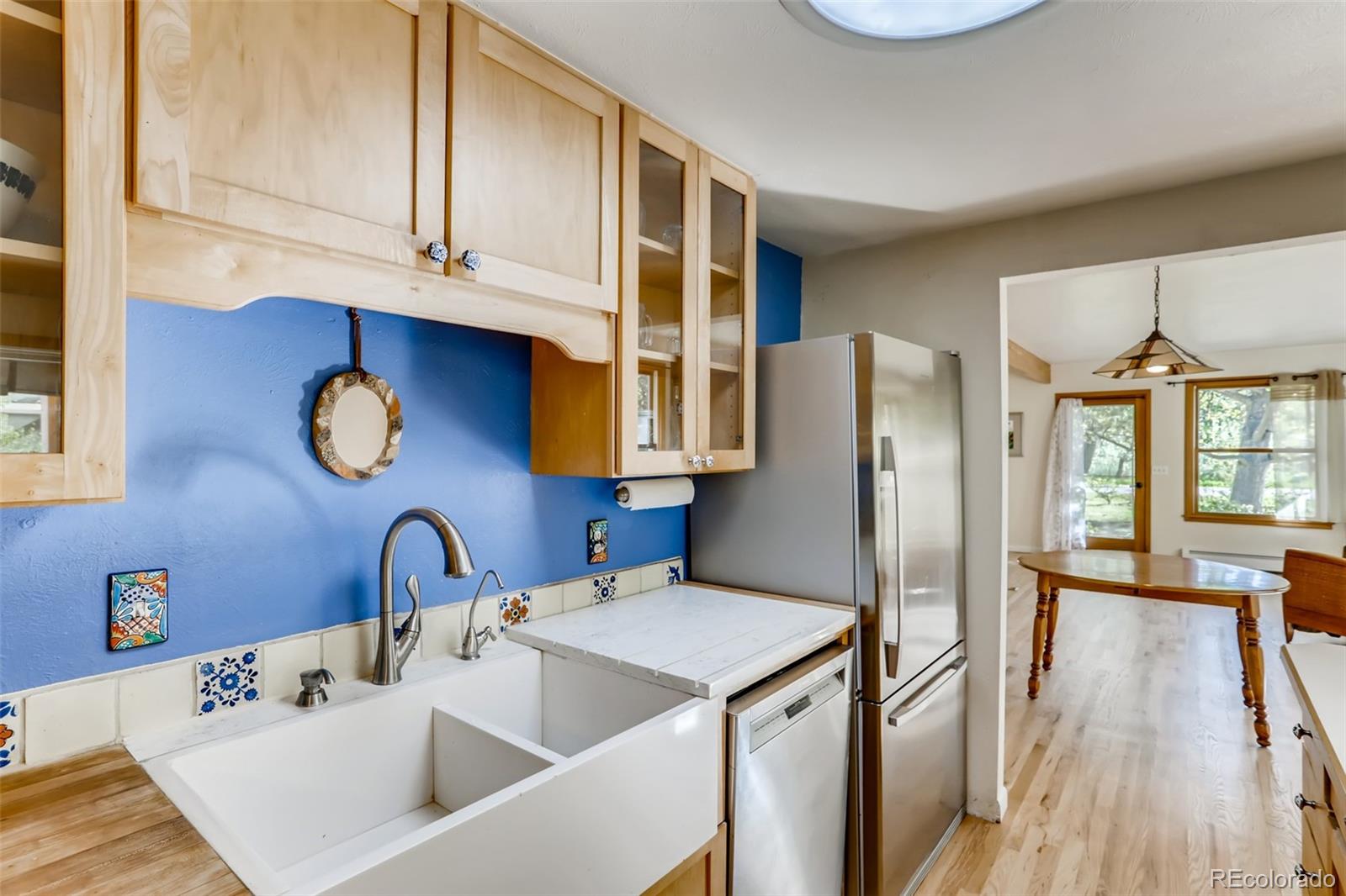 1521 Marshall Road Boulder, CO 80305 - Photo 10 of 40 a kitchen with stainless steel appliances a sink a refrigerator and cabinets