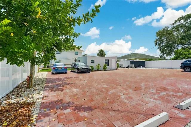 a view of street with parked cars