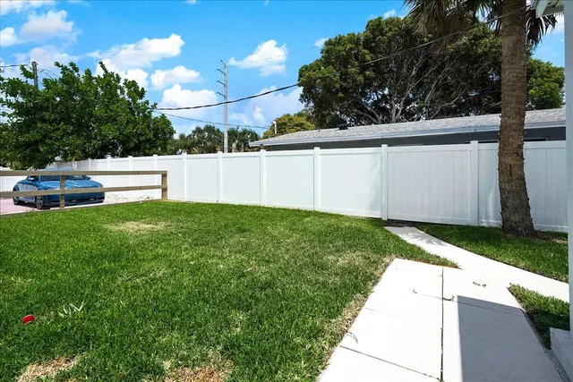an aerial view of multiple houses with yard