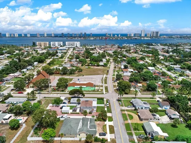 an aerial view of multiple houses with yard