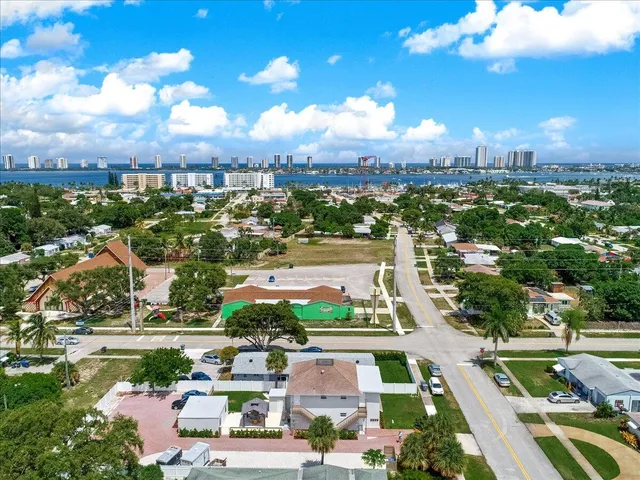 an aerial view of residential houses with outdoor space and swimming pool