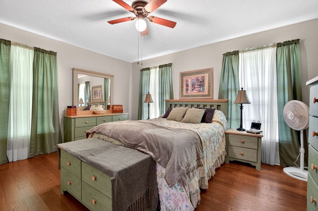 149 North Main Street Sparta, TN 38583 - Photo 12 of 14 a bedroom with a bed and a chandelier