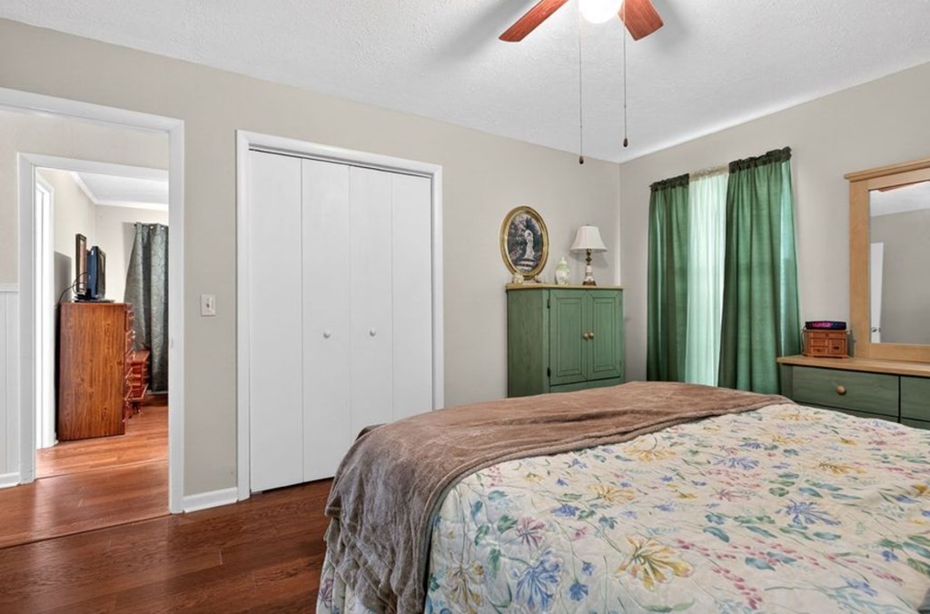 149 North Main Street Sparta, TN 38583 - Photo 14 of 14 a bedroom with a bed and a chandelier