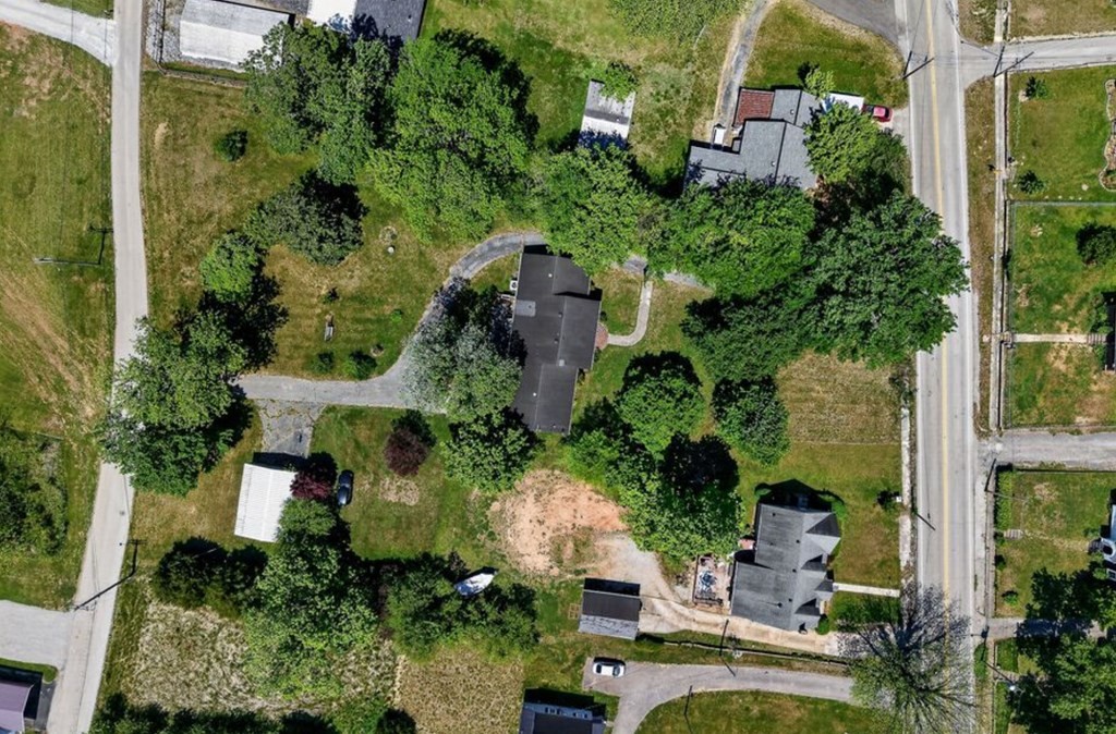 149 North Main Street Sparta, TN 38583 - Photo 2 of 14 an aerial view of a house with a yard and lake view