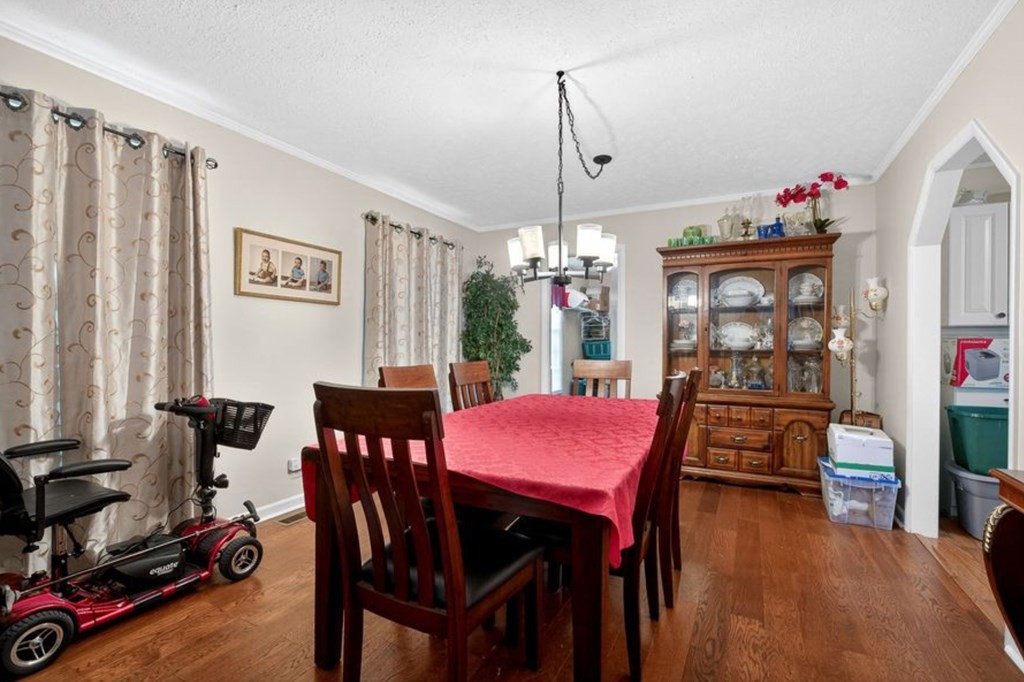 149 North Main Street Sparta, TN 38583 - Photo 8 of 14 a view of a dining room with furniture and chandelier