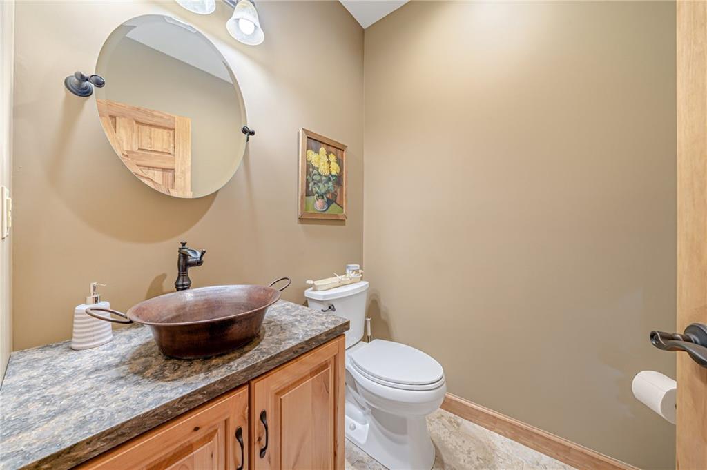 2780 Ipnar Road Irwin, PA 15642 - Photo 23 of 49 a bath room with a toilet a sink and a mirror