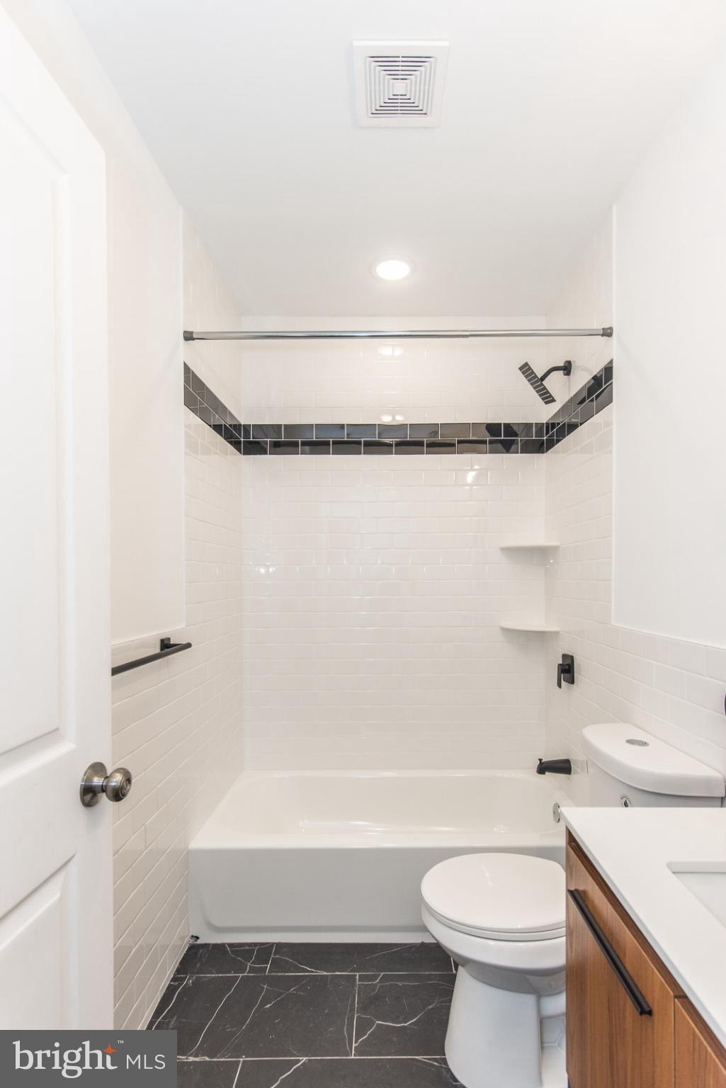 315 North Preston Street, Unit 101 Philadelphia, PA 19104 - Photo 19 of 26 a bathroom with a sink a toilet and a bathtub