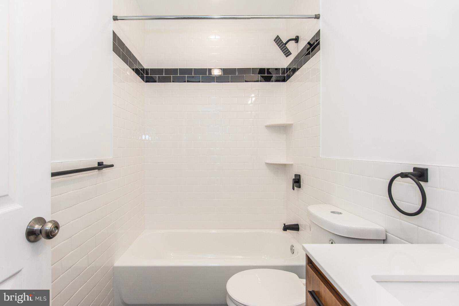 315 North Preston Street, Unit 101 Philadelphia, PA 19104 - Photo 20 of 26 a bathroom with a toilet sink and tub