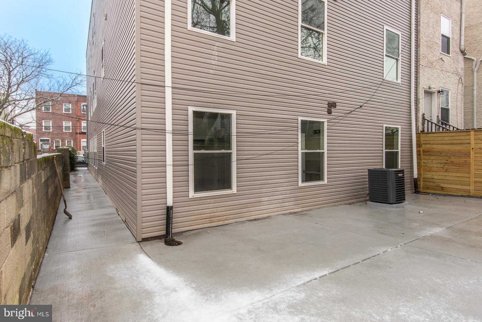 315 North Preston Street, Unit 101 Philadelphia, PA 19104 - Photo 26 of 26 a view of a house with a yard