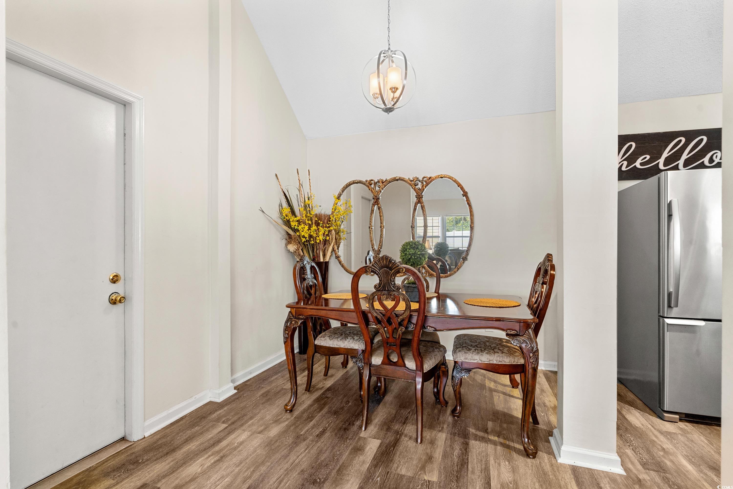 133 Whitehaven Court Myrtle Beach, SC 29577 - Photo 14 of 31 Dining room with a chandelier, wood-type flooring,