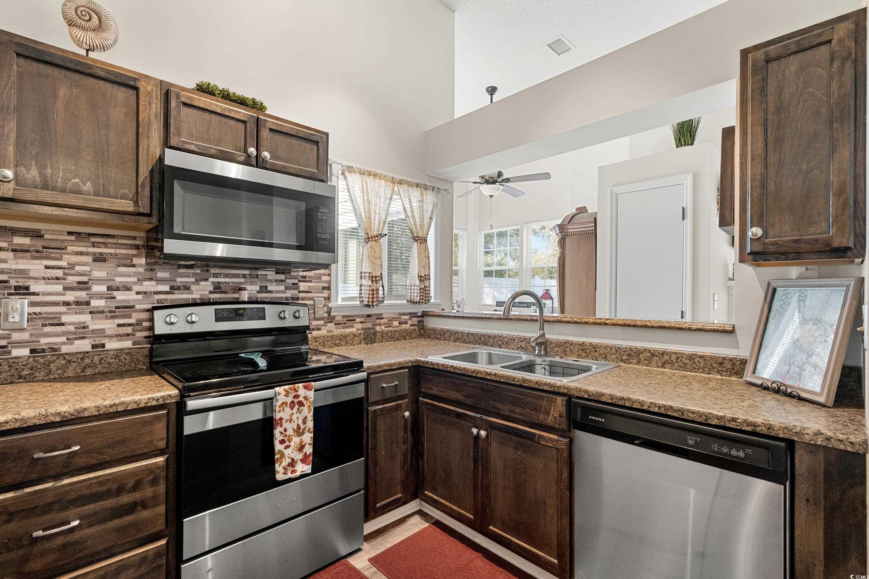 133 Whitehaven Court Myrtle Beach, SC 29577 - Photo 17 of 31 Kitchen with ceiling fan, stainless steel applianc