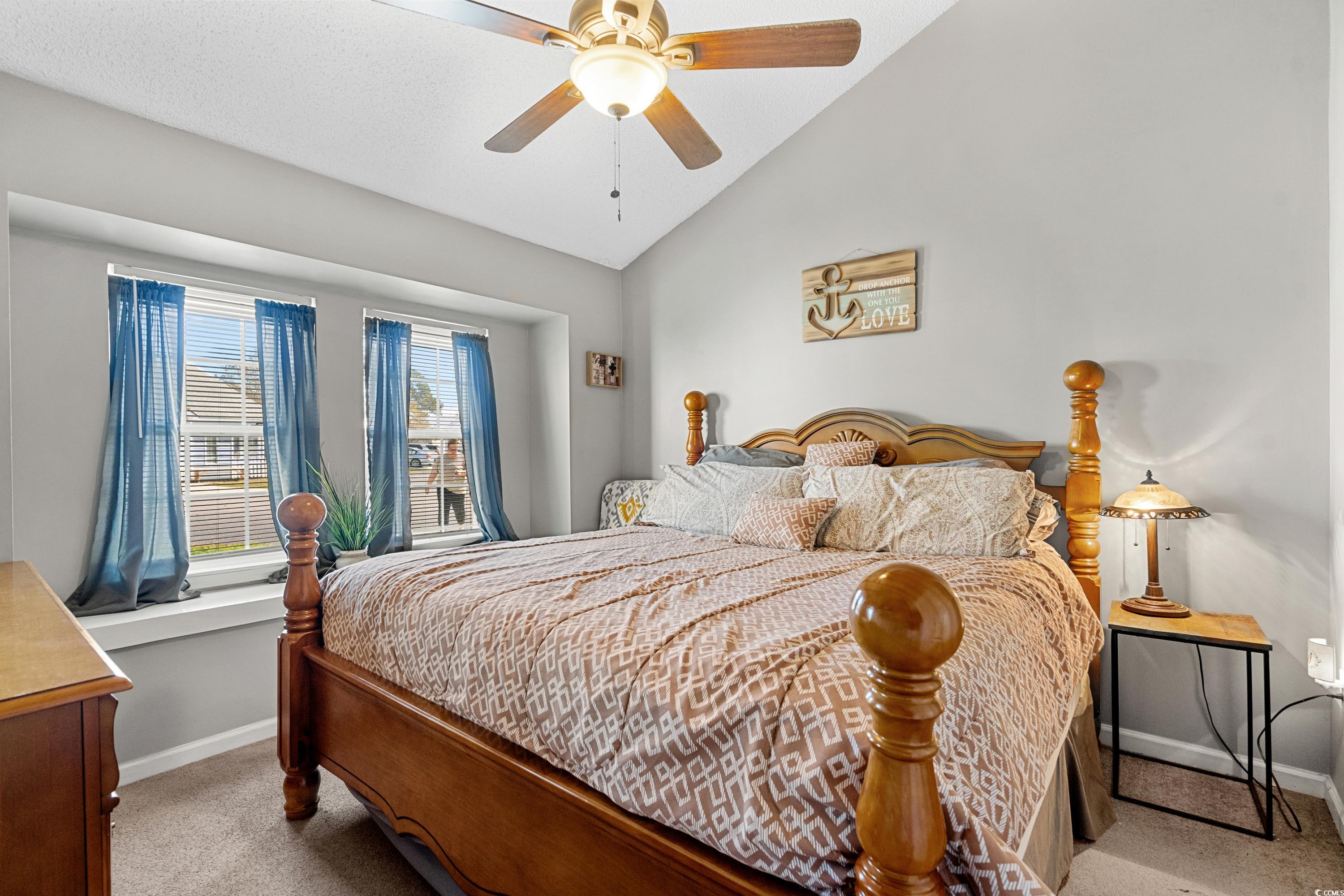 133 Whitehaven Court Myrtle Beach, SC 29577 - Photo 23 of 31 Bedroom featuring lofted ceiling, light carpet, an