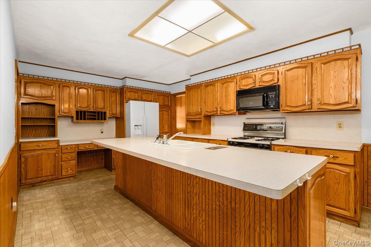307 Big Island Road Warwick, NY 10921 - Photo 13 of 46 a kitchen with stainless steel appliances a stove sink refrigerator and cabinets