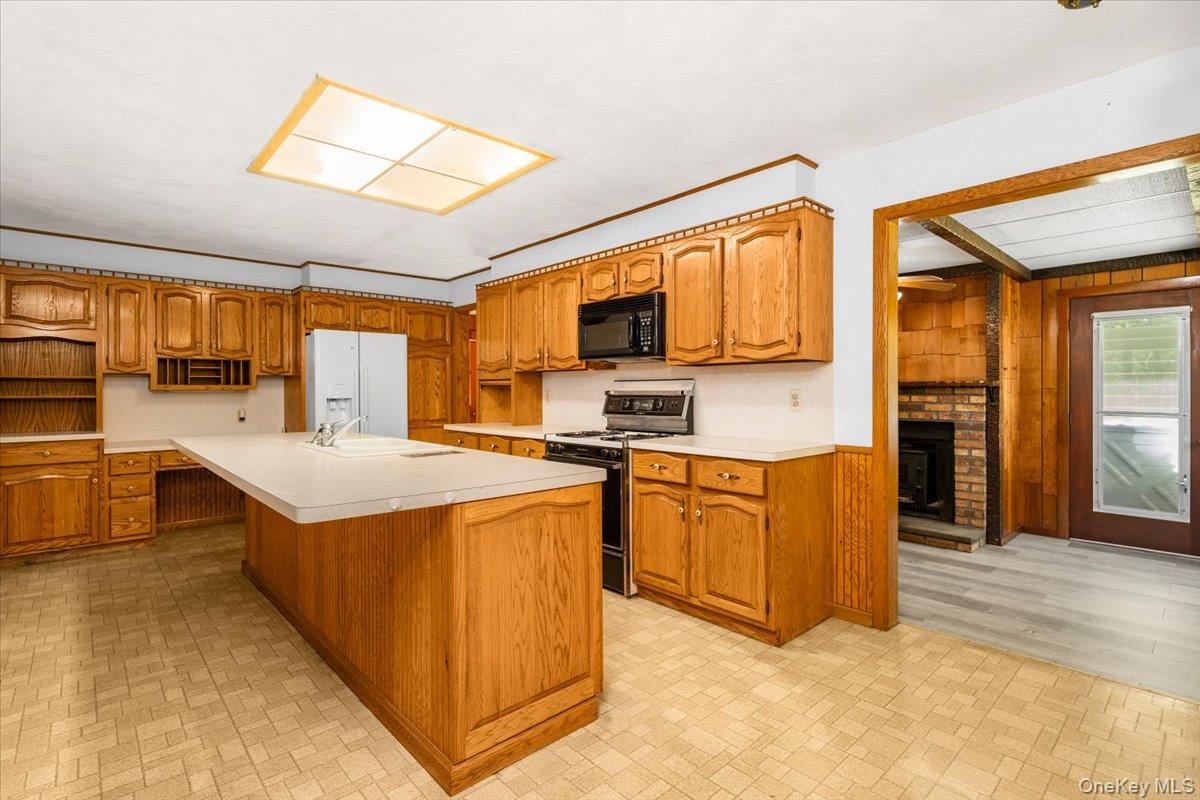 307 Big Island Road Warwick, NY 10921 - Photo 16 of 46 a kitchen with stainless steel appliances granite countertop a stove a sink and a refrigerator