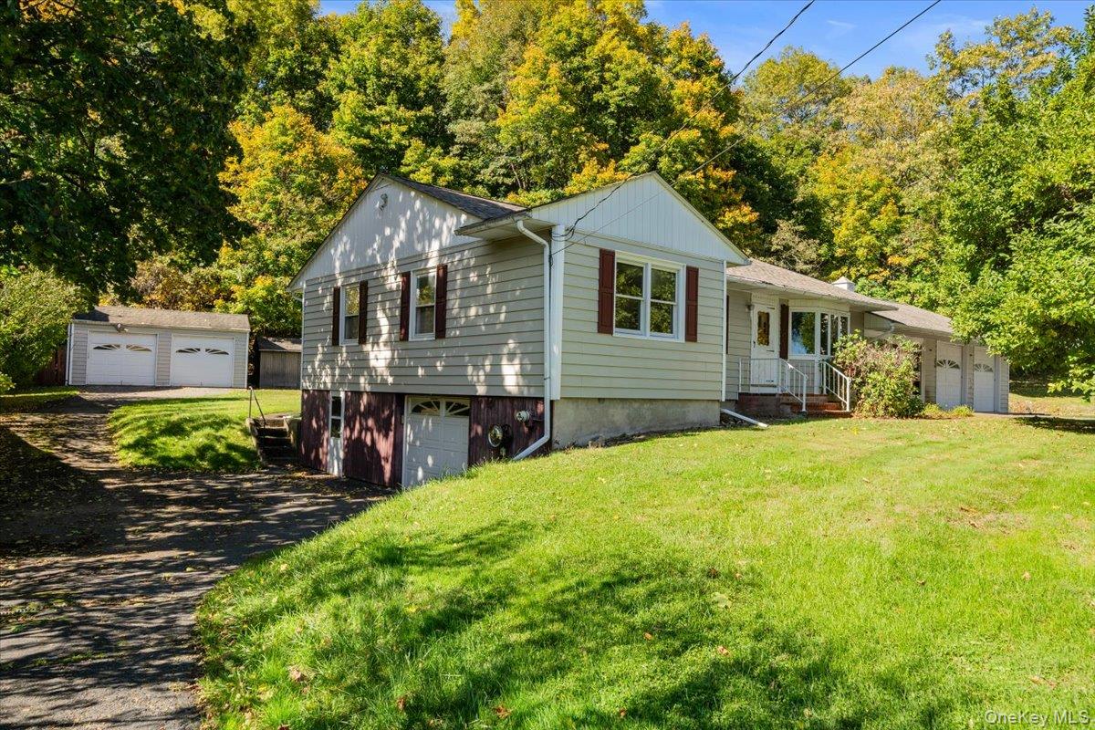 307 Big Island Road Warwick, NY 10921 - Photo 2 of 46 a front view of a house with a yard