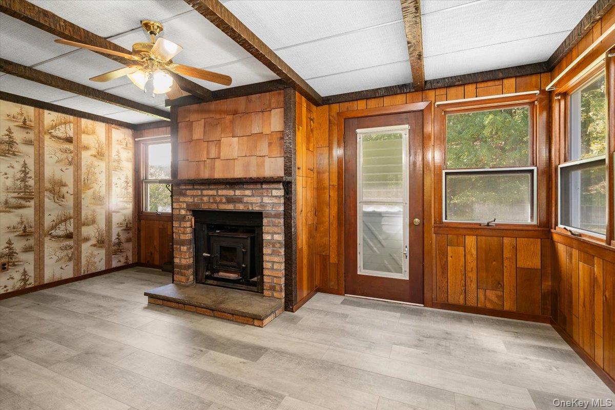 307 Big Island Road Warwick, NY 10921 - Photo 28 of 46 a view of an empty room with window and fire place