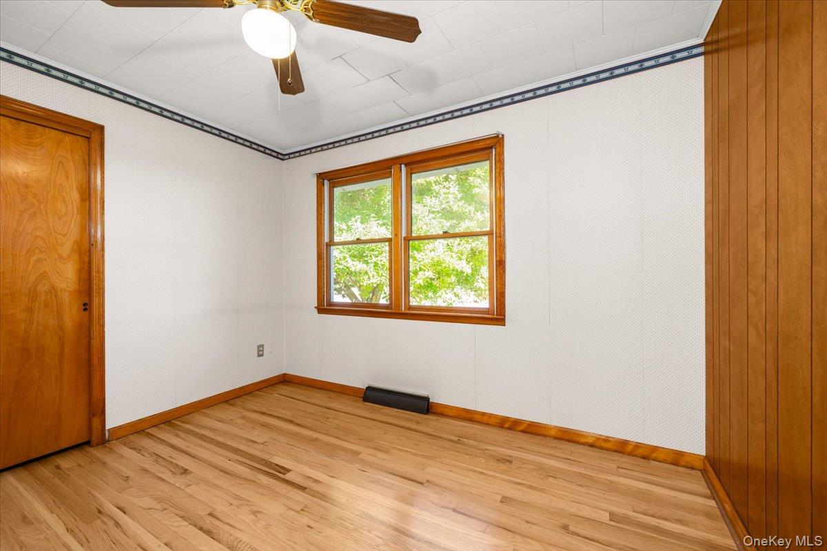 307 Big Island Road Warwick, NY 10921 - Photo 33 of 46 a view of empty room with wooden floor and fan