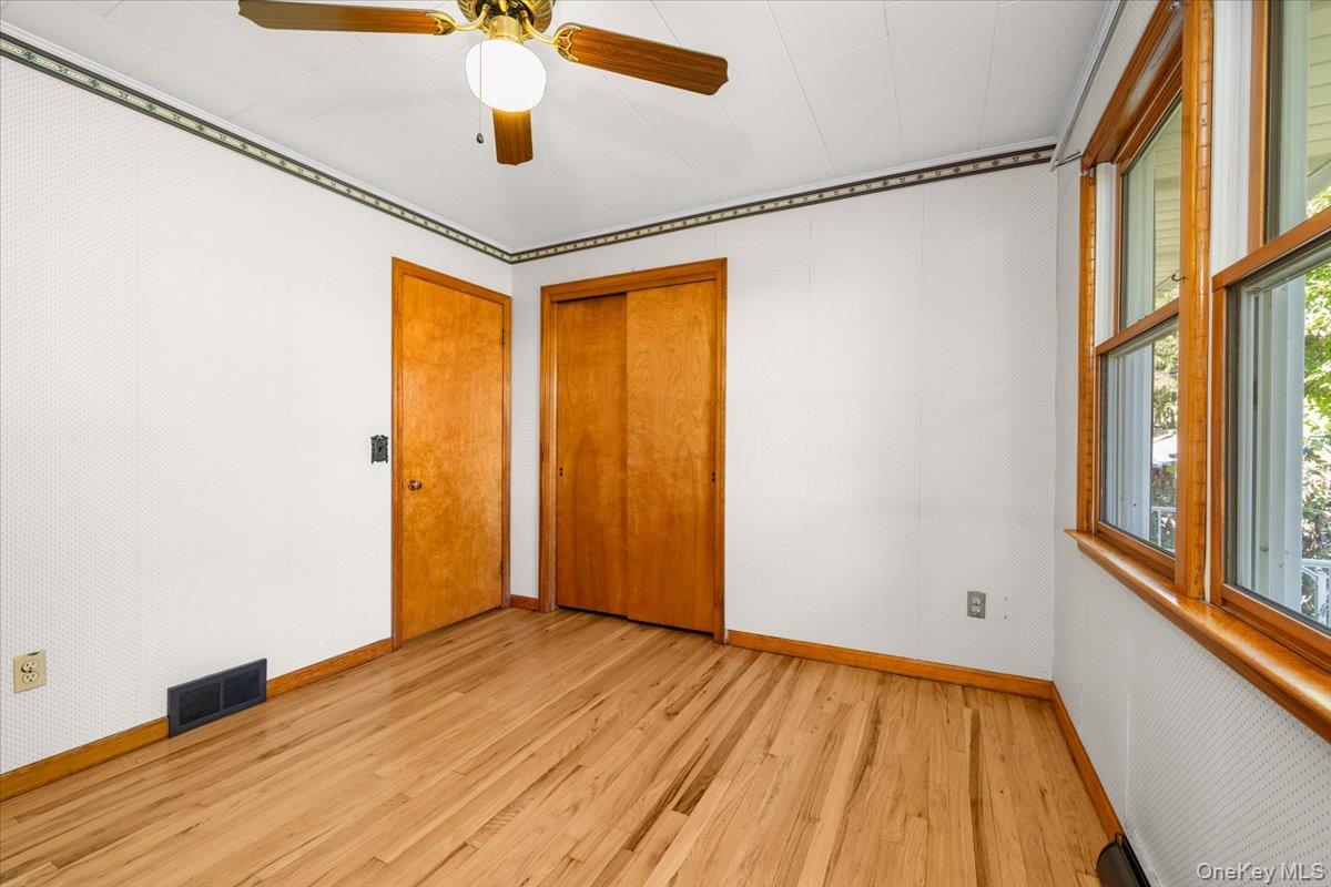307 Big Island Road Warwick, NY 10921 - Photo 34 of 46 a view of empty room with wooden floor and fan