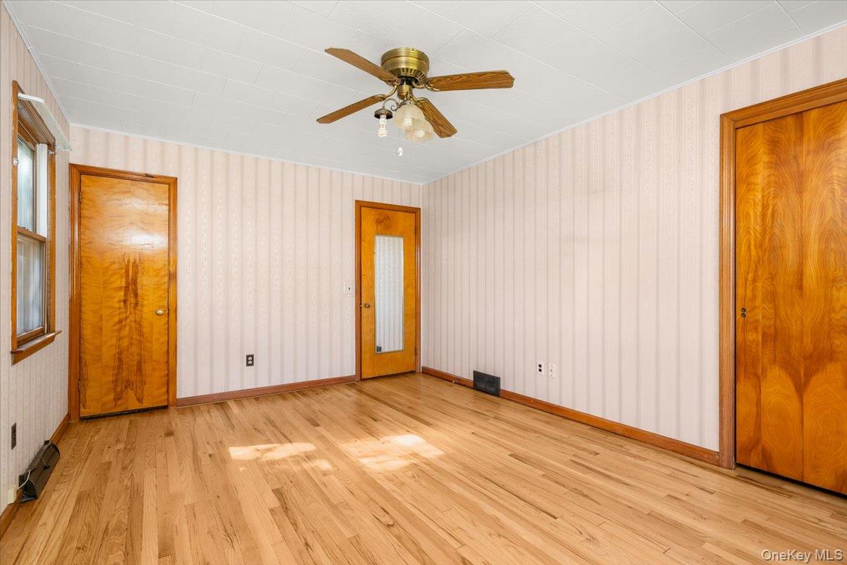 307 Big Island Road Warwick, NY 10921 - Photo 38 of 46 an empty room with window and a ceiling fan
