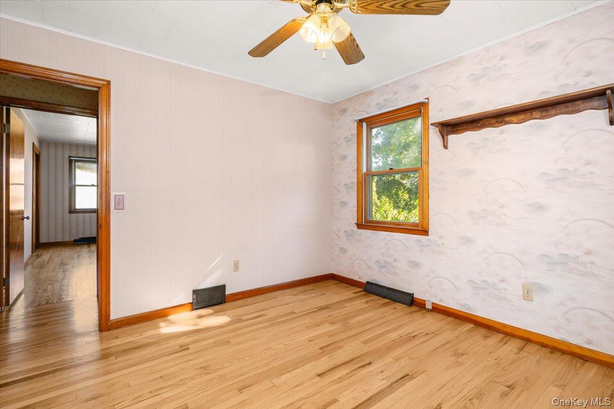 307 Big Island Road Warwick, NY 10921 - Photo 40 of 46 an empty room with wooden floor and windows