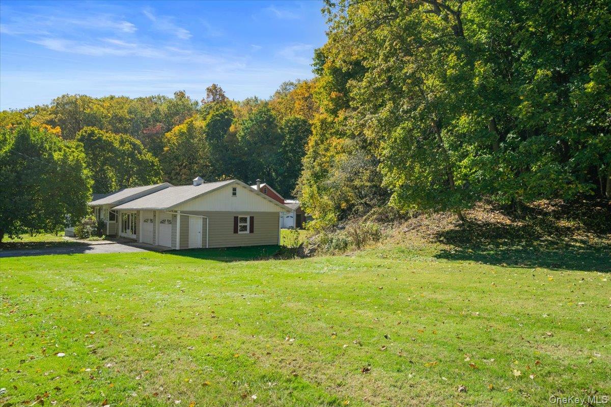 307 Big Island Road Warwick, NY 10921 - Photo 4 of 46 a front view of a house with a yard