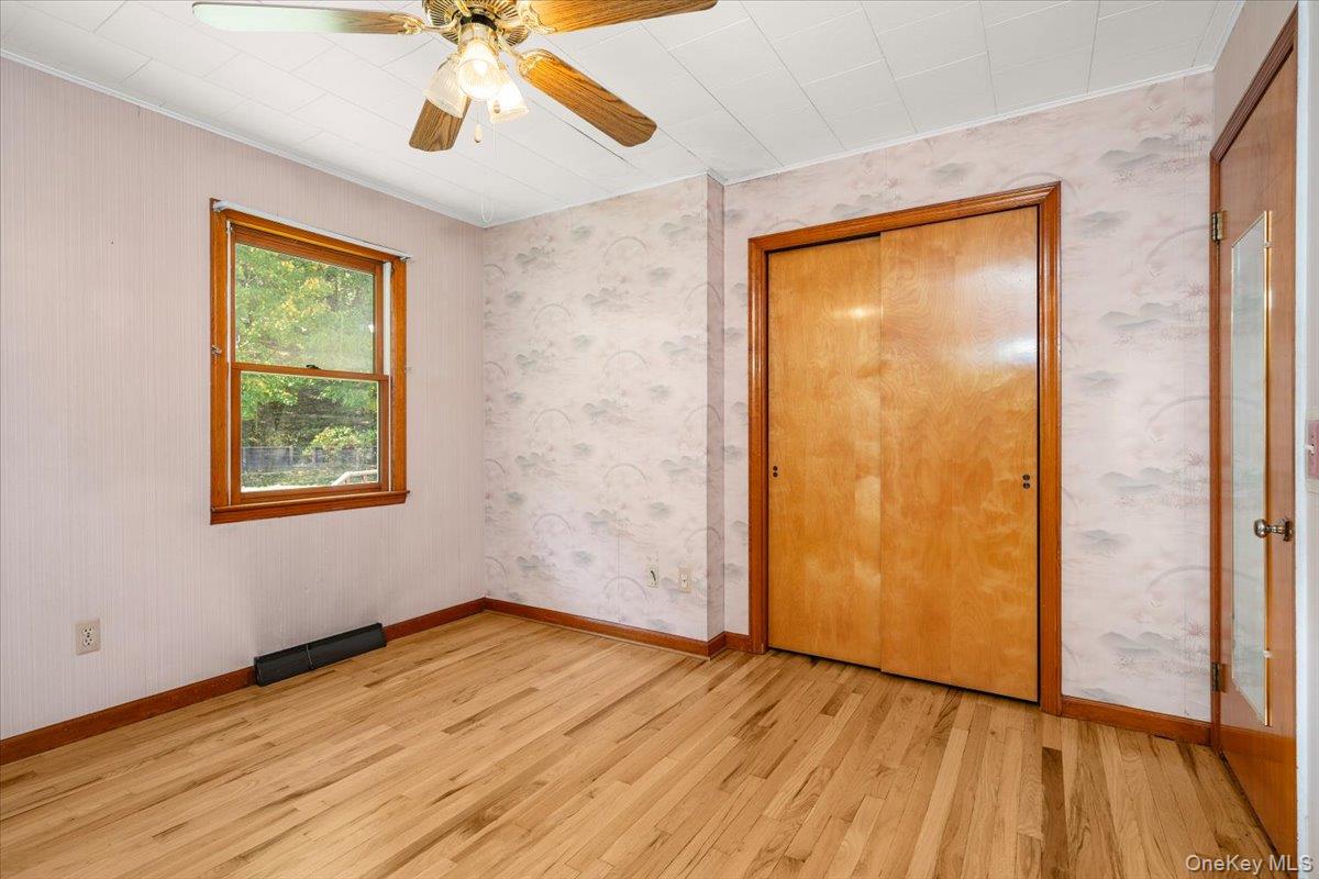 307 Big Island Road Warwick, NY 10921 - Photo 42 of 46 a view of an empty room with wooden floor and a window