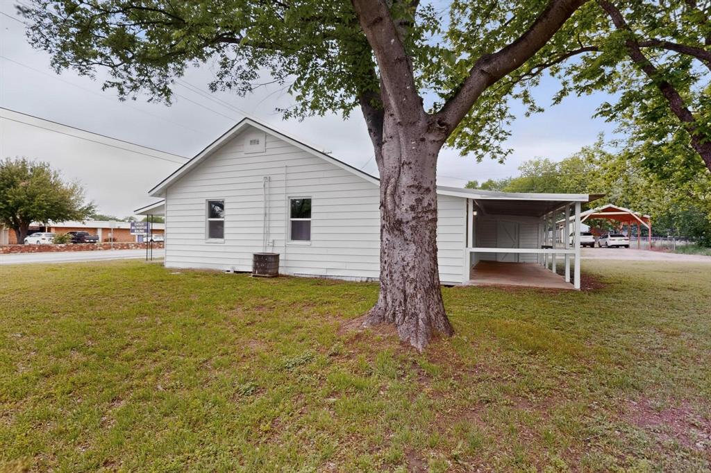 313 Farm To Market 316 Eustace, TX 75124 - Photo 31 of 33 a view of a house with backyard and a tree