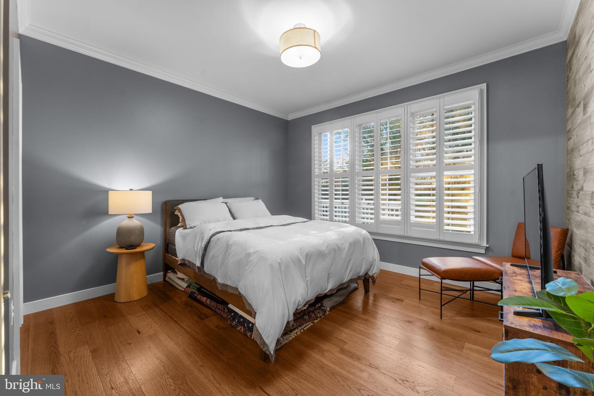 23375 Potts Mill Road Middleburg, VA 20117 - Photo 15 of 48 a bed room with a bed and a chair