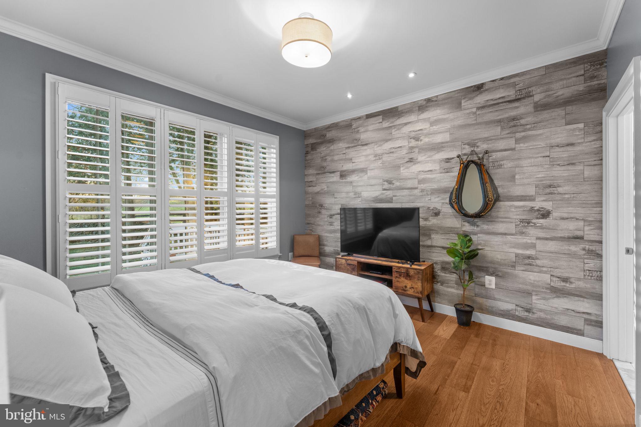 23375 Potts Mill Road Middleburg, VA 20117 - Photo 16 of 48 a bedroom with a bed chair and a table