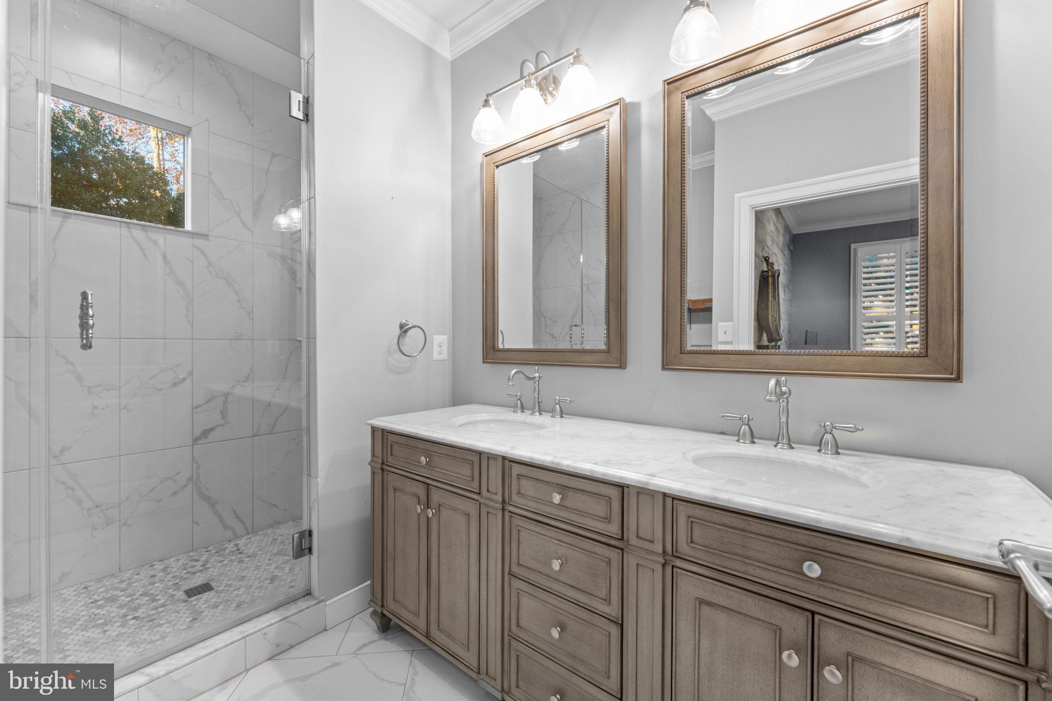 23375 Potts Mill Road Middleburg, VA 20117 - Photo 18 of 48 a bathroom with a shower sink and mirror