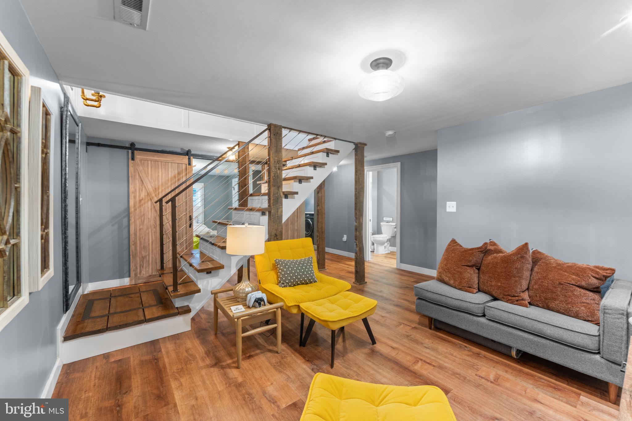 23375 Potts Mill Road Middleburg, VA 20117 - Photo 20 of 48 a living room with furniture a rug and a chandelier