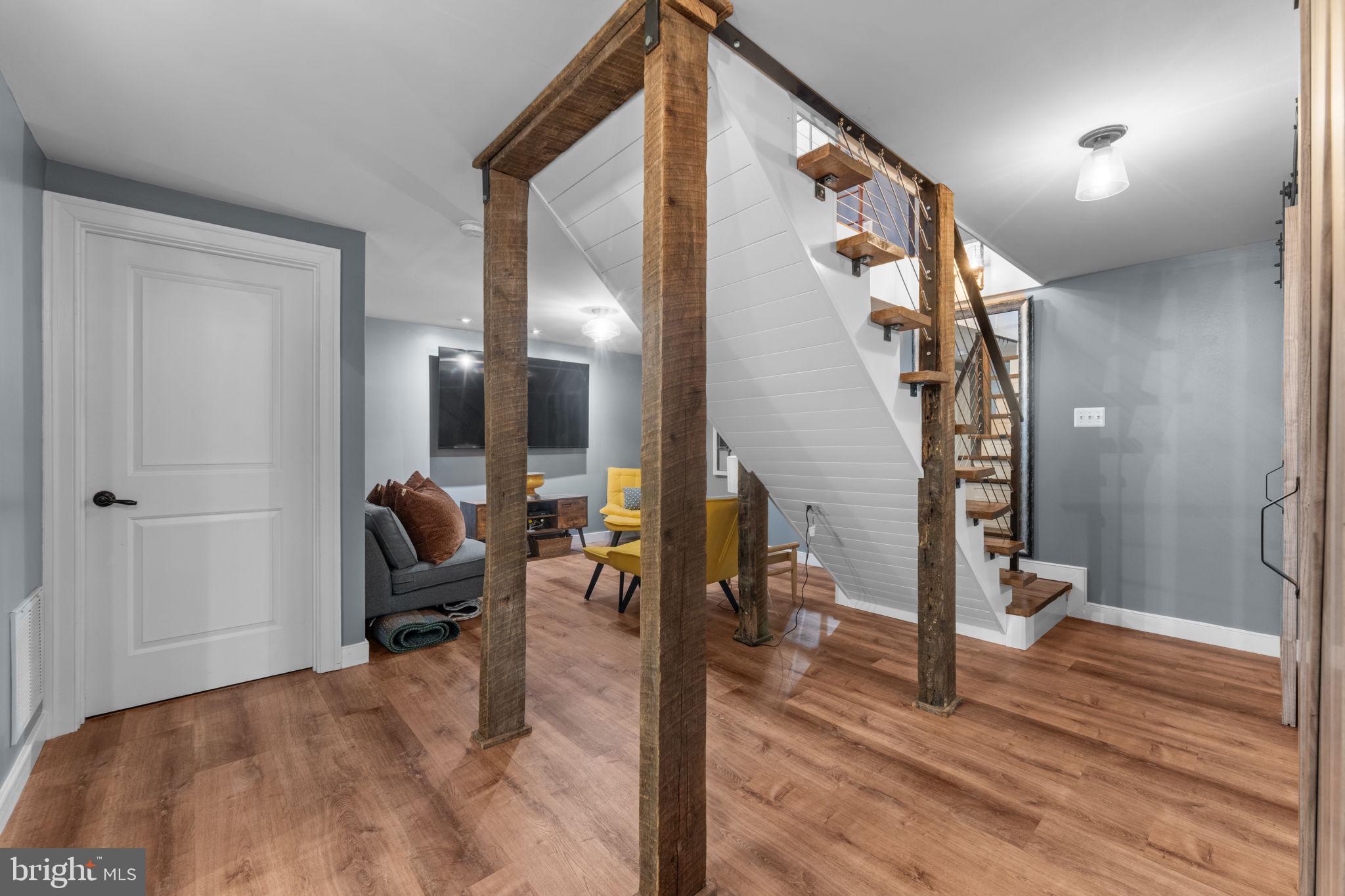 23375 Potts Mill Road Middleburg, VA 20117 - Photo 22 of 48 a view of a hallway with wooden floor and furniture